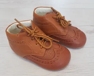 Tan brogue style boots