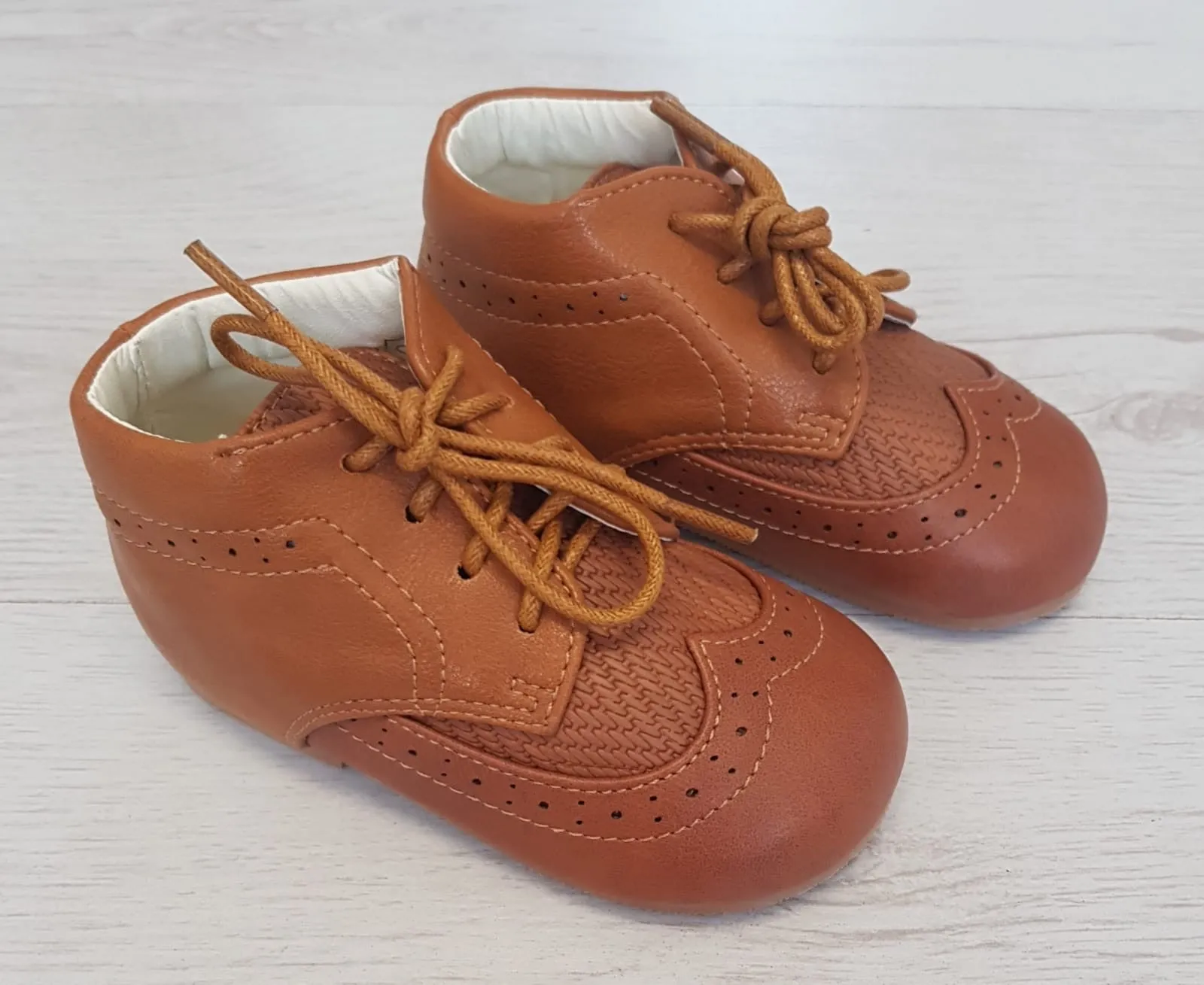 Tan brogue style boots